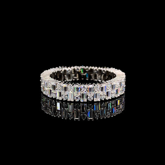 A sterling silver ring with a row of round and baguette cut diamonds.